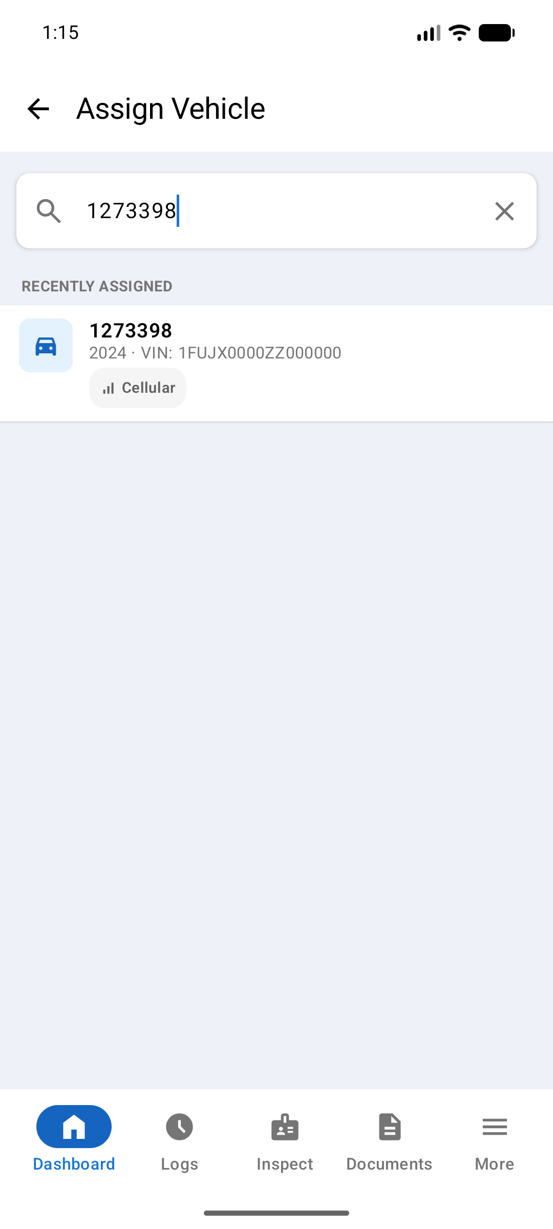 Assign Vehicle screen with a unit number typed into search and one matching vehicle listed