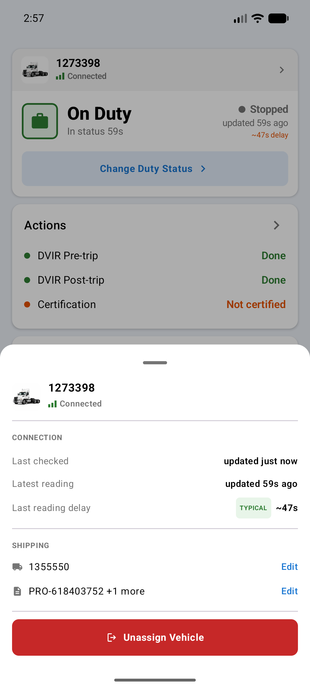 Vehicle detail sheet showing the unit number as Connected, a Connection section with last checked, latest reading, and a last reading delay marked Typical, a Shipping section with the trailer and shipping documents, and a red Unassign Vehicle button
